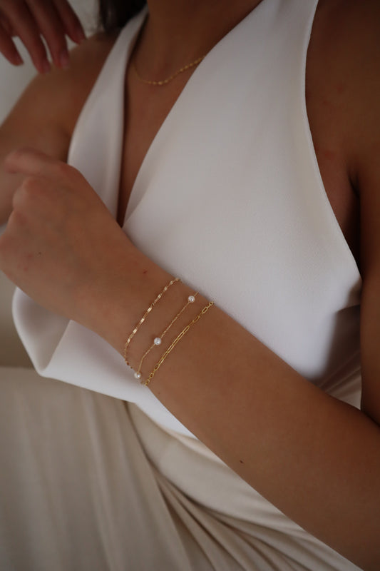 how to stack dainty gold jewelry